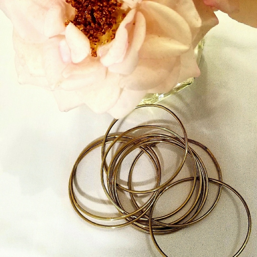 Gold toned interlocking bangle bracelets